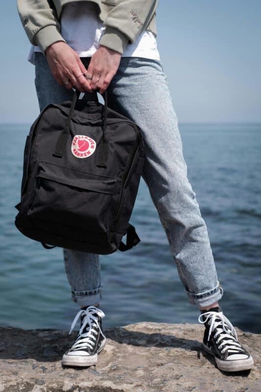 traveler with fjällräven kånken in sweden
